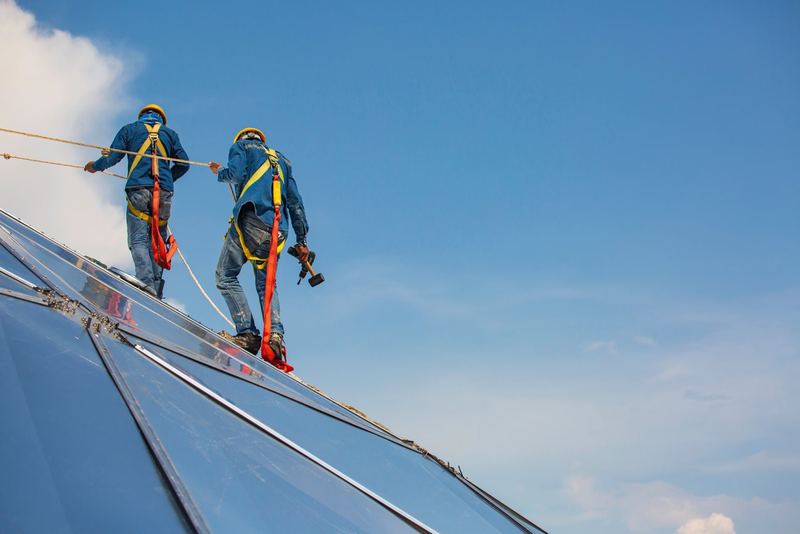 Harnessed technician on anchored lines