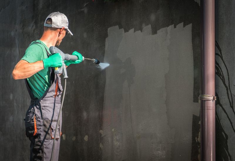 Soft washing a commercial building exterior