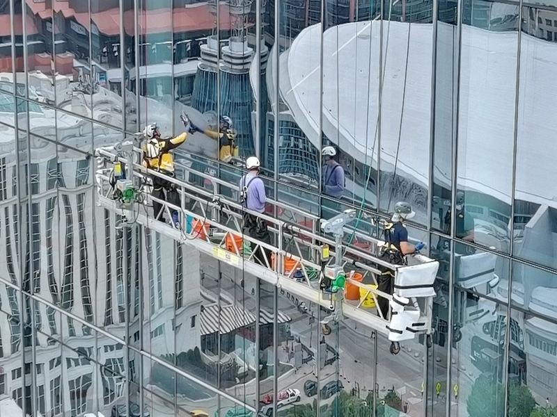 Commercial window cleaning technician